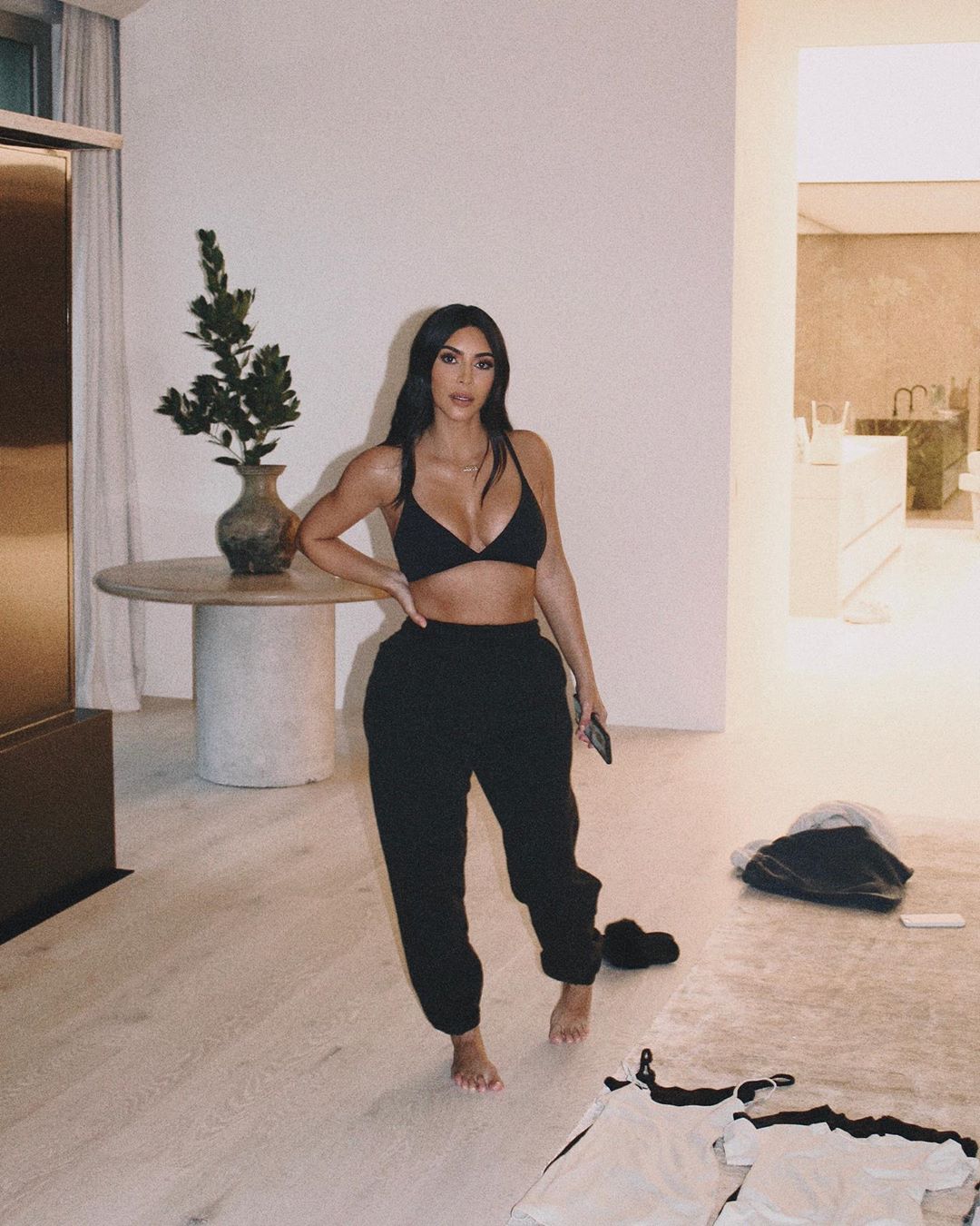 SKIMS on X: Ultra-soft and comfortable, @KimKardashian wears the Cotton Triangle  Bralette in Soot. Shop now in sizes XXS - 4X at    / X