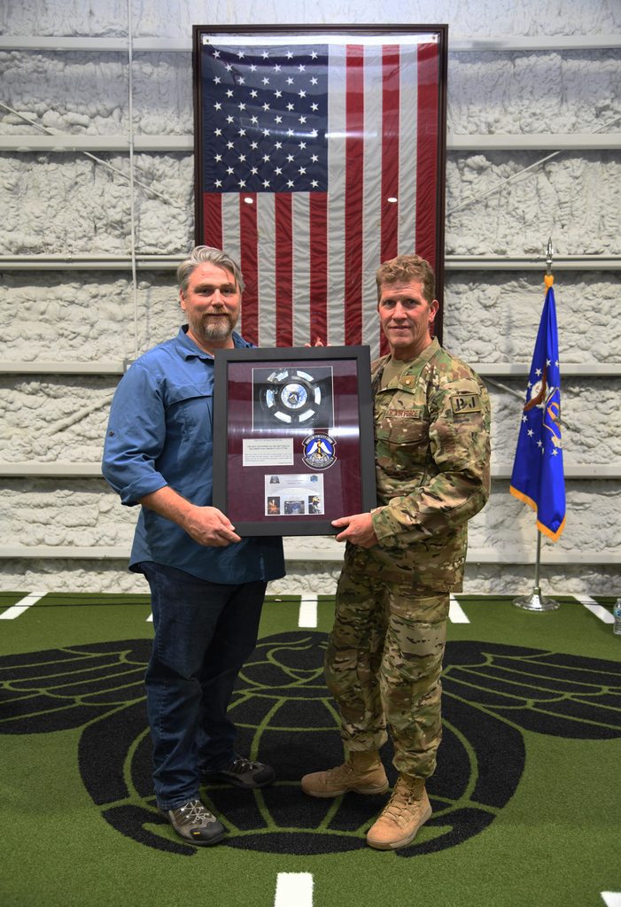 SpecWarAirmen's tweet photo. Brent Maney, Human Space Flight and former PJ, and Chief Master Sgt. Michael Ziegler, 308th Rescue Squadron pose with the beret that was flown in space which was presented to him during his retirement ceremony #pararescue #specialwarfareairmen #patrickafb #thatothersmaylive https://t.co/XBWn3XDuD4