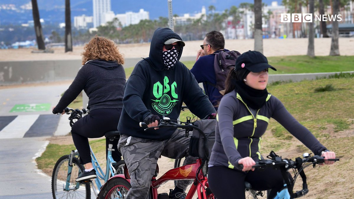 People cycling, wearing masks in the US