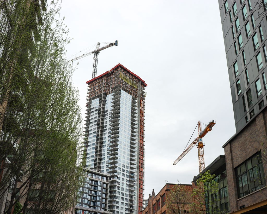 Garner_WBE's tweet photo. Two of our Denny Triangle area projects — right across the street from each other! Garner operator Jeff Toycen operates the Liebherr at 2019 Boren for Holland, and our expert hoist operating team runs the three man/material hoists at 1120 Denny for Onni. https://t.co/jX55xgdswj