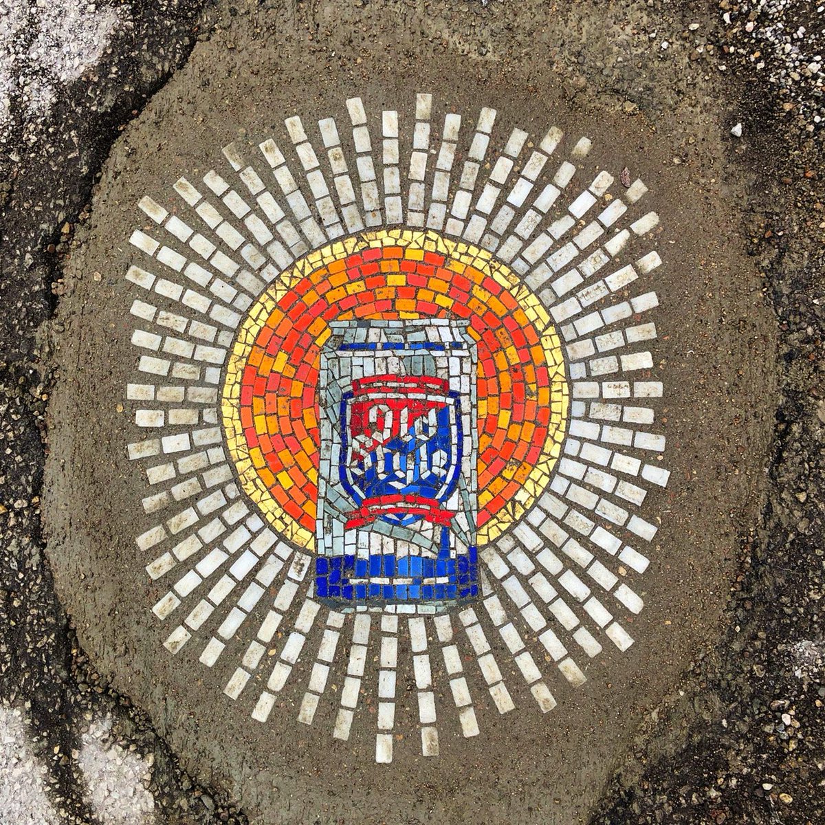 lonelyplanet's tweet photo. Chicago artist turns potholes into unbelievable pandemic-themed mosaics - https://t.co/Afr2qOoJv4 https://t.co/63Xxi6j1zC