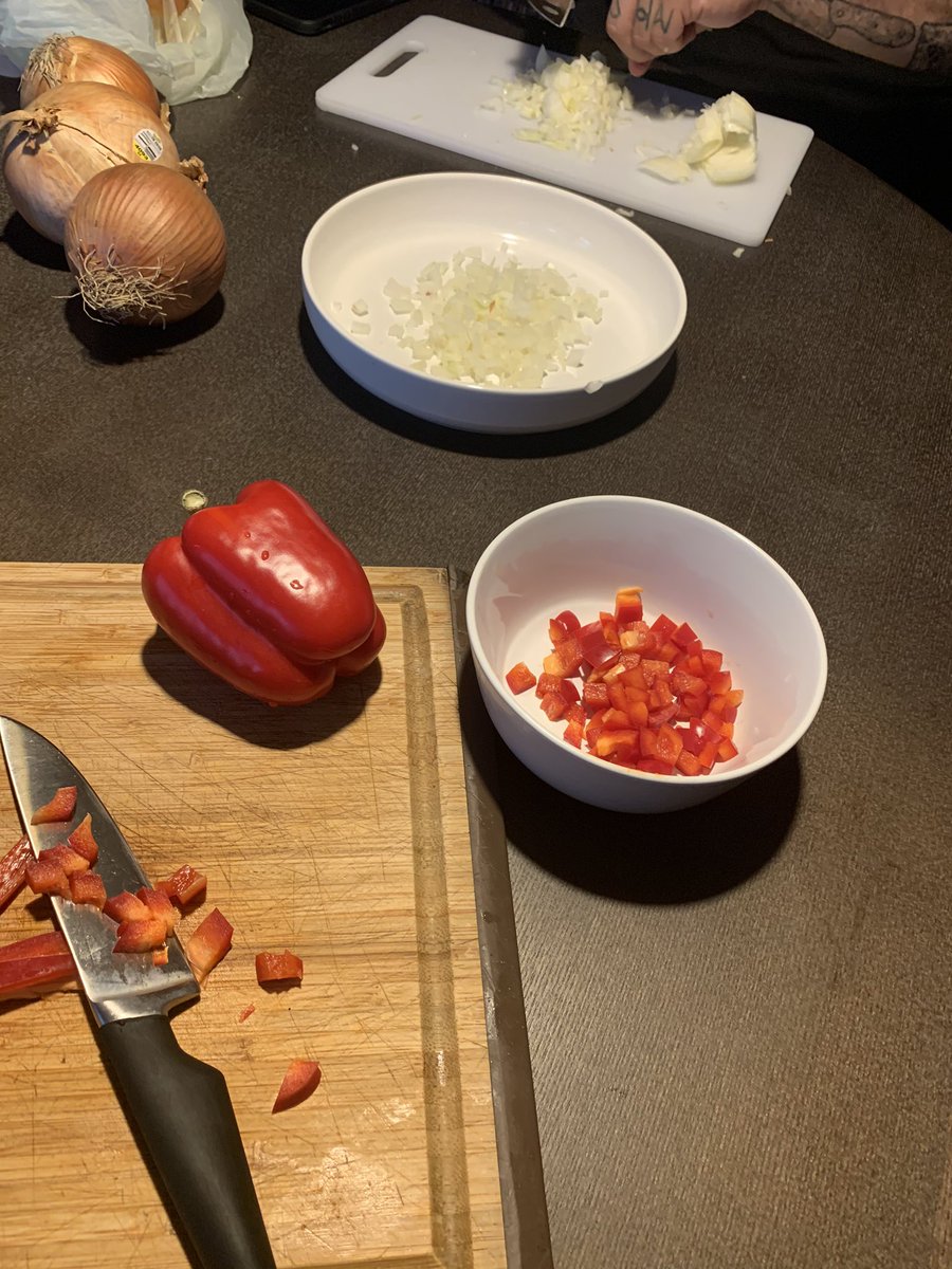 Right now we are dicing the onions and red pepper