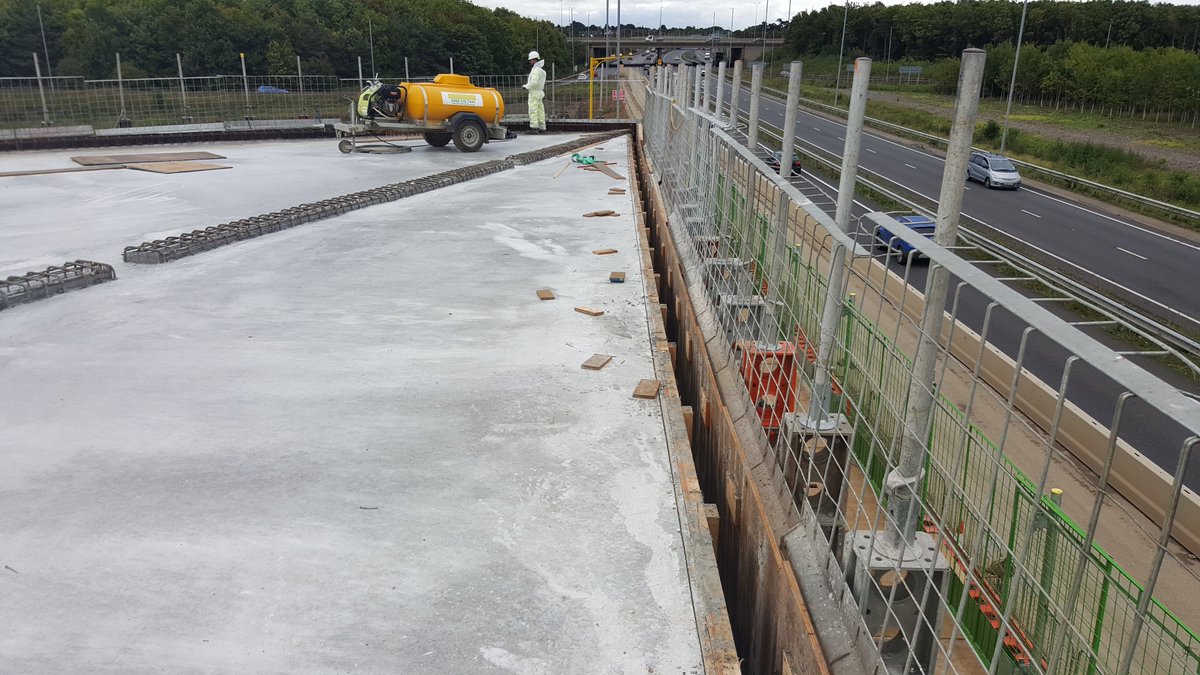 Once concrete had cured the shutters would be removed and next pour prepared. Pic 1 is top of deck slab looking towards Girton Jct, Pic 2 is a side-on pic of the deck slab showing how thick it is - the self-weight is enormous before you put 2 lanes of HGVs on top! 24/