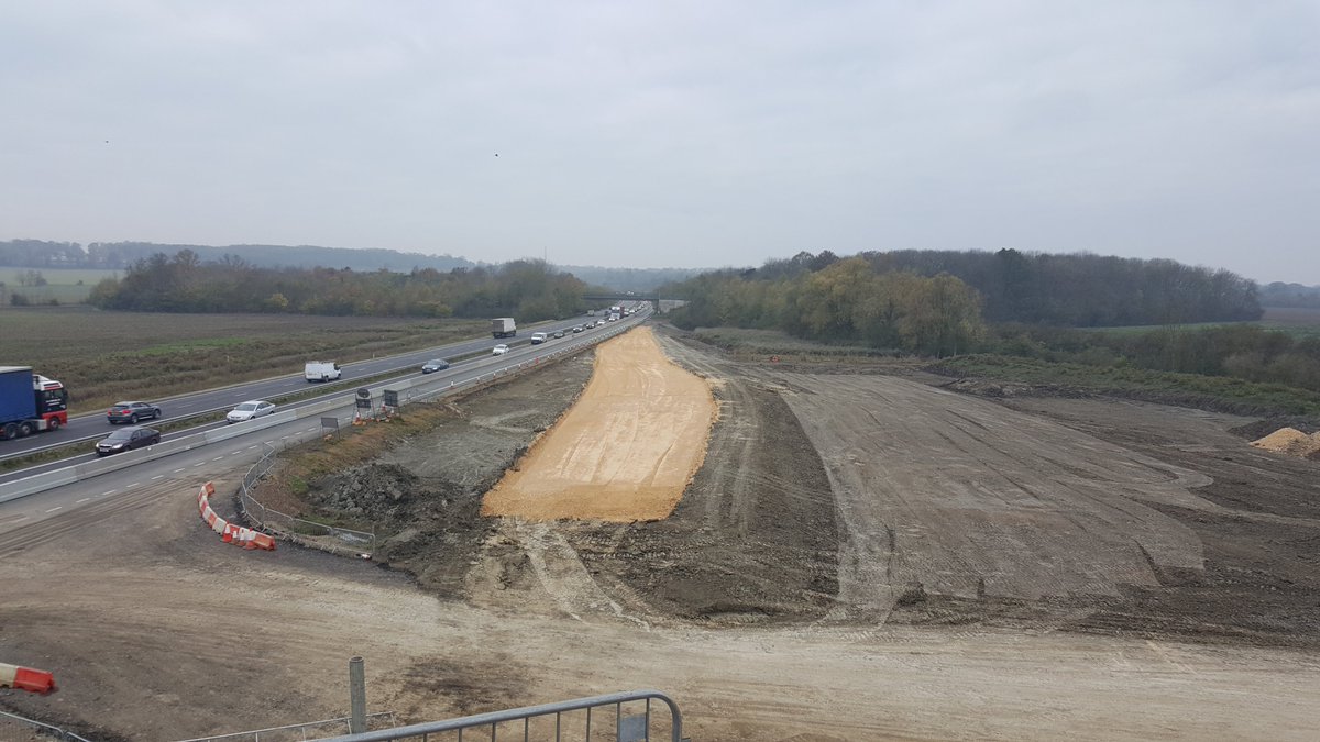 November 2017 and the roads team make a start on building the new A428 eastbound through the structure - Pic 1 looking west, pic 2 looking east at Girton jct, both from new bridge- the yellow stone is the foundation layer in the highway pavement construction known as sub-base 26/