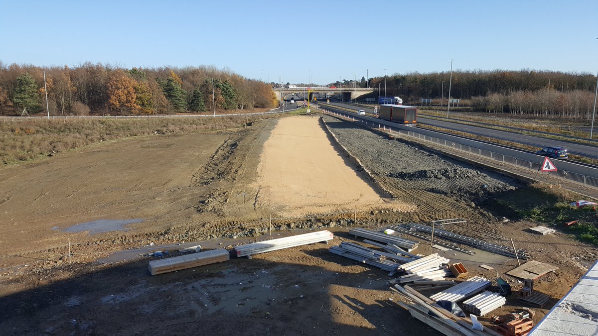 November 2017 and the roads team make a start on building the new A428 eastbound through the structure - Pic 1 looking west, pic 2 looking east at Girton jct, both from new bridge- the yellow stone is the foundation layer in the highway pavement construction known as sub-base 26/