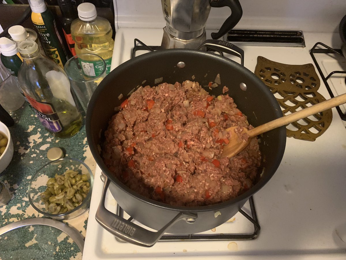 Now add the ground beef after letting the red pepper cook with the onions for a bit and mix them all together