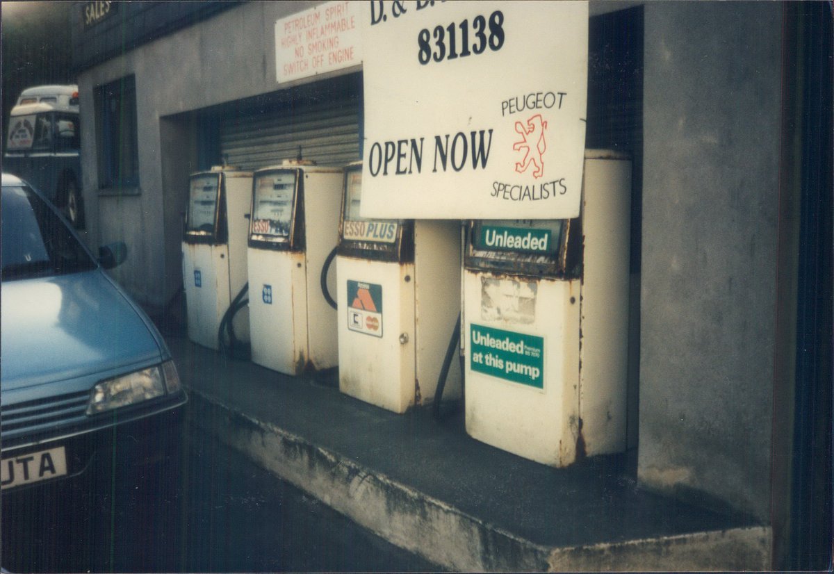 Day 135 of  #petrolstationsEsso, D&D Motors, Modbury, Devon 1994  https://www.flickr.com/photos/danlockton/16069991720/  https://www.flickr.com/photos/danlockton/16231470866/Wonderful array of old pumps—a '30s Avery Hardoll & 4 '60s Wayne—at this Peugeot garage on a sharp bend in a south Devon village. Garage still going; pumps have gone