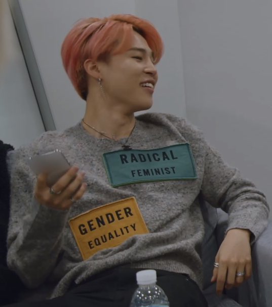 pjm_jm13's tweet photo. I am gonna quote here : 
"Radical feminism is a perspective within feminism that calls for a radical reordering of society in which male supremacy is eliminated in all social and economic contexts." 
Also Jimin's shirt says "GENDER EQUALITY" so stop twisting everything . https://t.co/YFxGxyAulg