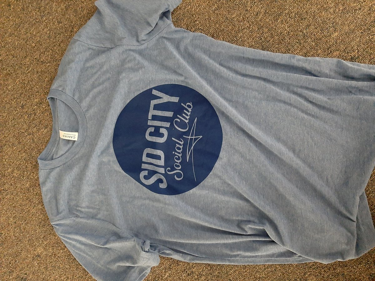 sidcityonline's tweet photo. I accidentally rekindled the Great Dress Debate of 2015 with a poorly lit photo of the blue tri-blend tee on FB. As a result, we've added a GRAY option for the cotton tee. But also, I swear the tri-blend is BLUE!

Order at https://t.co/AtuozFGOm5

#SidCitySocialClub #BlueOrGray https://t.co/KvKAZvBQ7R