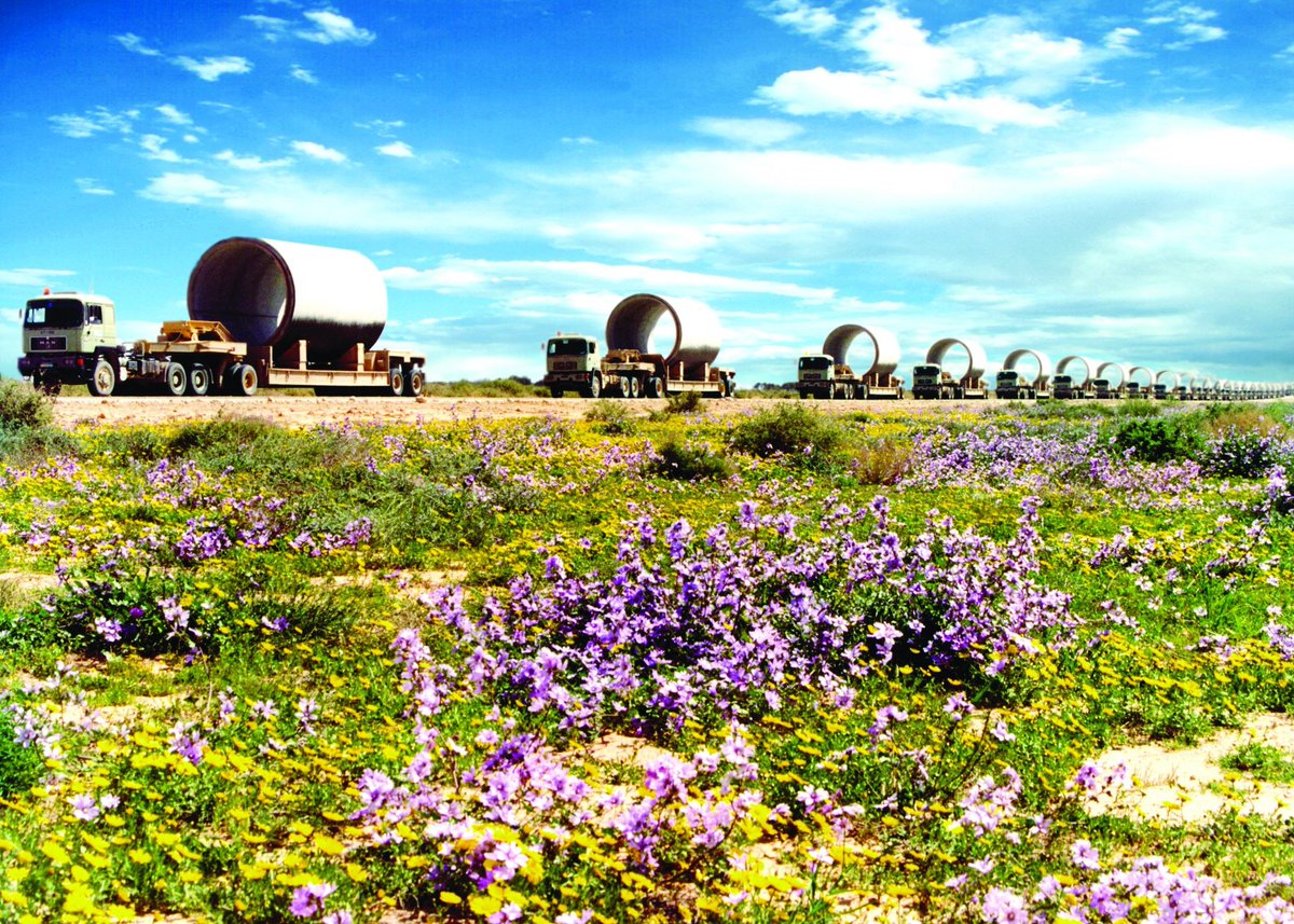 The leader Muammar Gaddafi prays to Allah and thanks Him for the blessing of the water he gave to the Libyan people, after the opening ceremony of the Gurdabiya dam, which is a phase of Libya's 'Great Man-Made River' water project, some 30 kms east of the city of Sirte.