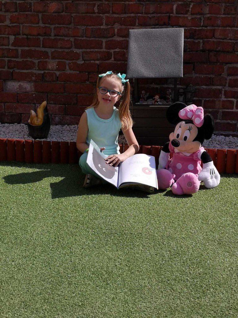 sjvblackpool's tweet photo. Here’s one of our Reception children reading a story to her Minnie Mouse Teddy in her garden 📚☀️#SJVReading #GetBlackpoolReading @Literacy_Trust #SJVClassRR https://t.co/bdeP0MS41G