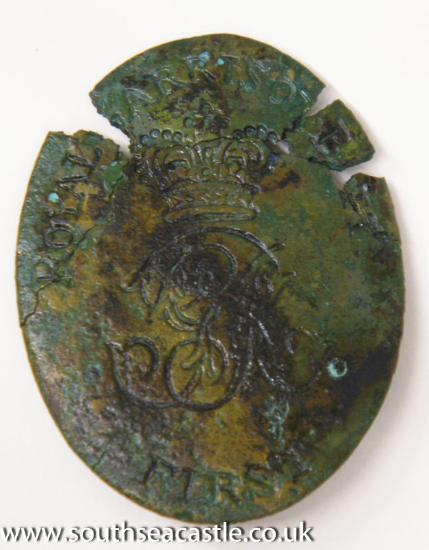 This belt buckle (or badge) is from the uniform of the 1st Royal Garrison Battalion, soldiers based at Southsea Castle 1803-1806. It was found on the beach, not far from the castle. It was probably lost by a soldier passing by. #southseacastle #soldier #archaeology