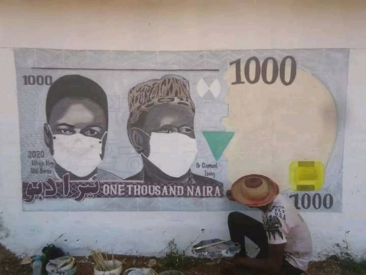 navybrandon3323's tweet photo. A Nigerian Artist, Bamaiyi Danladi Art, pictured painting on the wall for this COVID-19 season.

He drew a 1000 Naira note with nose mask on the faces of those on the notes. https://t.co/V3hGBu4RCH