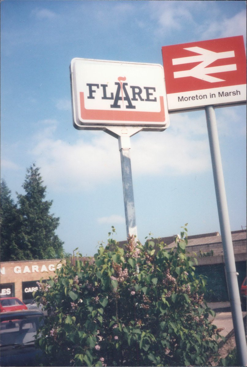 Day 137 of  #petrolstationsFlare, Station Garage, Moreton-in-Marsh, Gloucestershire, 1998  https://www.flickr.com/photos/danlockton/16071155449/Only the Flare sign (with blue part of the logo faded away) was left, next to the British Rail  @_doublearrow on the approach to the station. Site now redeveloped.