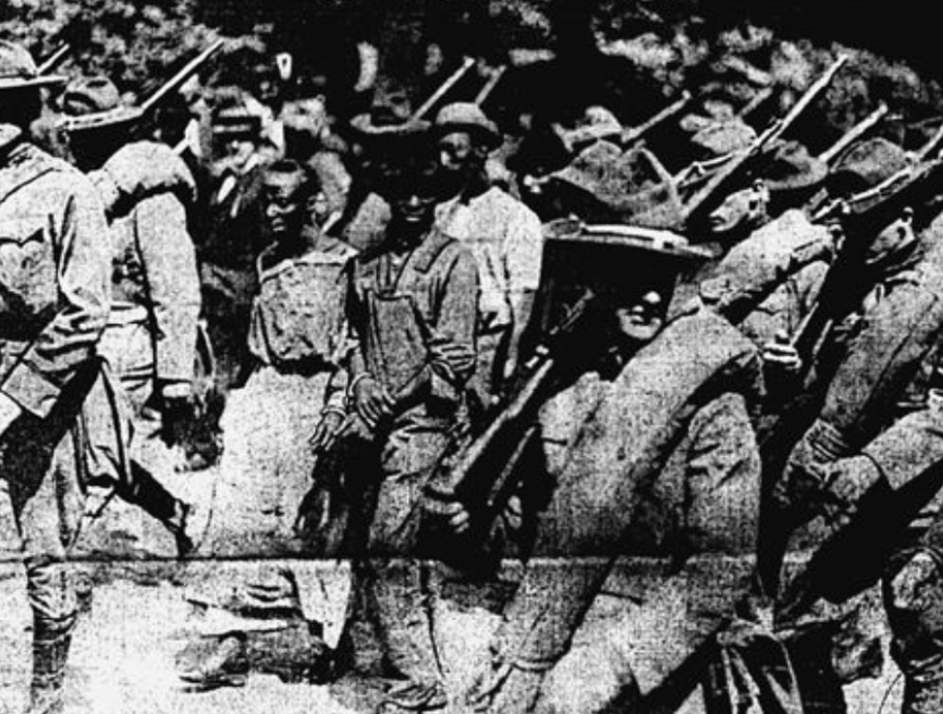 Weeks later they are taken back to Forsyth Co. for trial.They are paraded through the streets of Atlanta in chains, surrounded by 167 state militiamen.(siblings Jane & Oscar Daniel shown in photo, surrounded by troops)