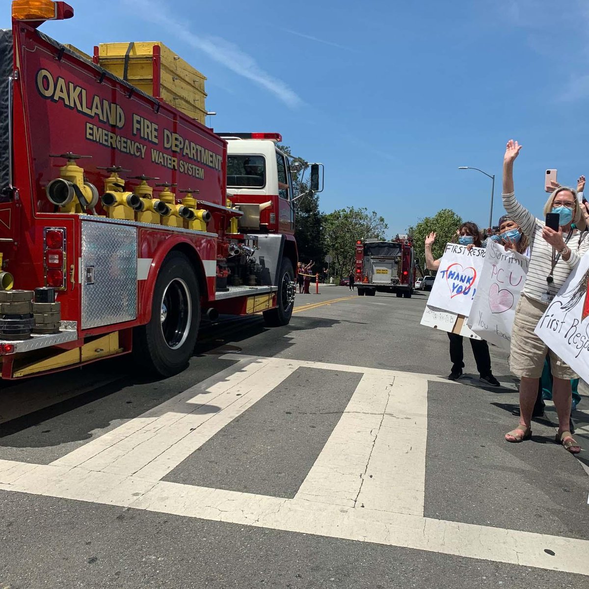 SutterHealth's tweet photo. Thank you to @OaklandFireCA, @oaklandpoliceca & all the first responders who honored East Bay #healthcareheroes, including Alta Bates Summit Medical Center staff & doctors, with this very special salute! #SutterStrong https://t.co/sk2lFVSV4d
