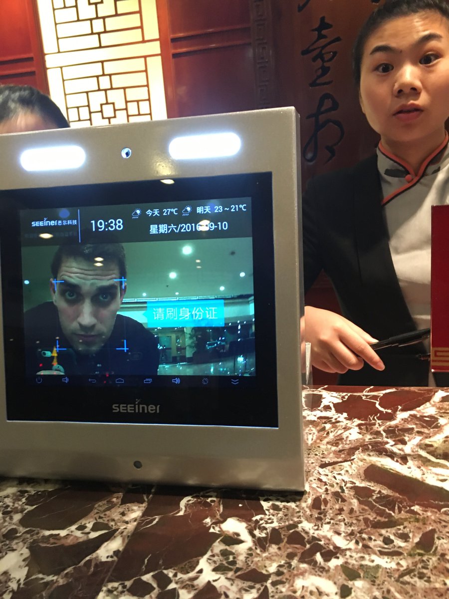 China pic, day 14:Checking into a hotel that required a face scan, Xiaoshan District, Hangzhou, 2016. I was freaked out that the front desk was scanning my face. The front desk lady was freaked out that I was taking a picture of them scanning my face.