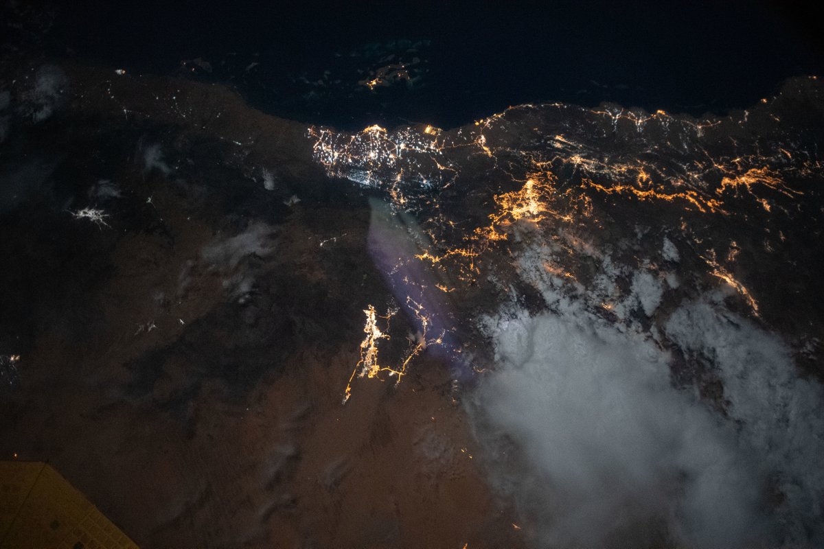 Space_Station's tweet image. The moonlit hues of Earth's terrain and seas glow dimly as city lights glitter on the Red Sea and Persian Gulf coasts. @NASA_Earth | flic.kr/s/aHsmACYoYM