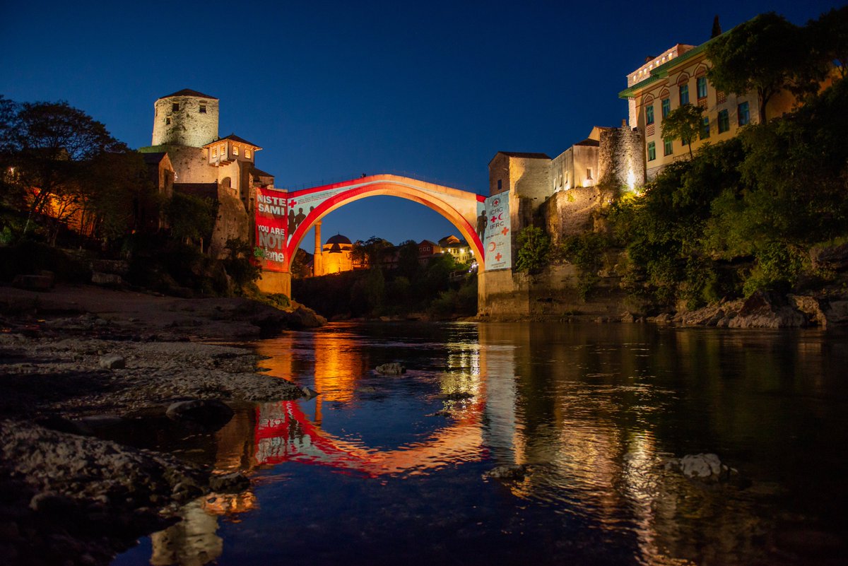 ICRC_BiH's tweet photo. We are grateful to all volunteers and employees of the Red Cross, for their dedicated work and selfless commitment in their response to COVID-19 in BiH. In their honor, we painted buildings in Sarajevo, Mostar, and Bijeljina in the colors of the Red Cross. #YouAreNotAlone https://t.co/T654RgImiT