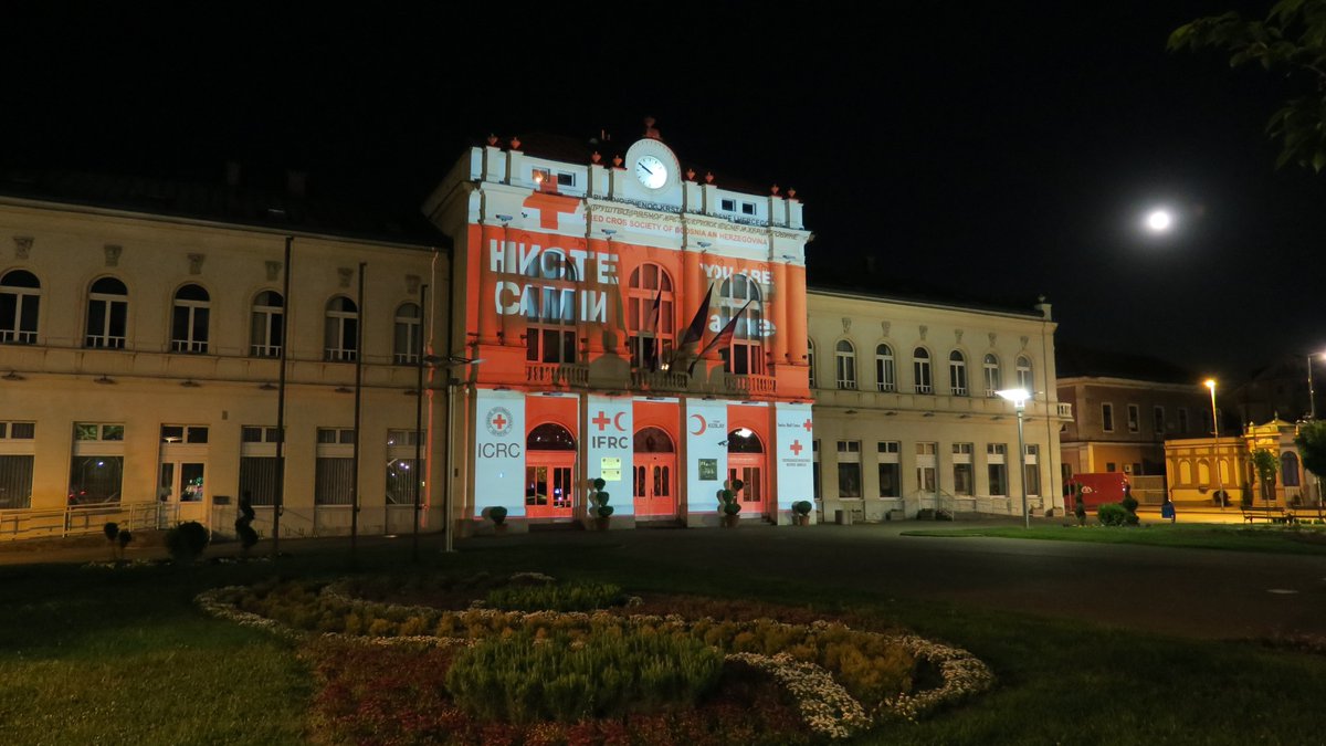 ICRC_BiH's tweet photo. We are grateful to all volunteers and employees of the Red Cross, for their dedicated work and selfless commitment in their response to COVID-19 in BiH. In their honor, we painted buildings in Sarajevo, Mostar, and Bijeljina in the colors of the Red Cross. #YouAreNotAlone https://t.co/T654RgImiT