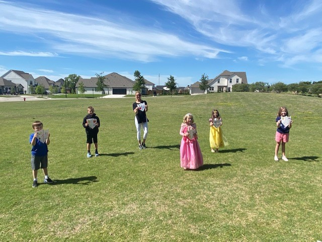 asesftw's tweet photo. Kindergarten's Cinderella Ball looks a little different this year. Pictured is Mrs. Yater doing a lesson on family shields and how to be a valiant knight. #nobleblue #theonetrueblue https://t.co/rijvwWYOND