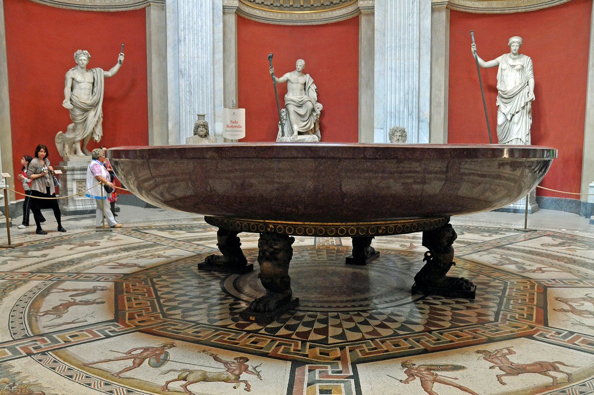 This gigantic basin - 25 feet in diameter - now on display at the Vatican, was purportedly made as a bathtub for the Emperor Nero. It& #39;s likely the single largest intact piece of Roman Imperial porphyry that survives today.