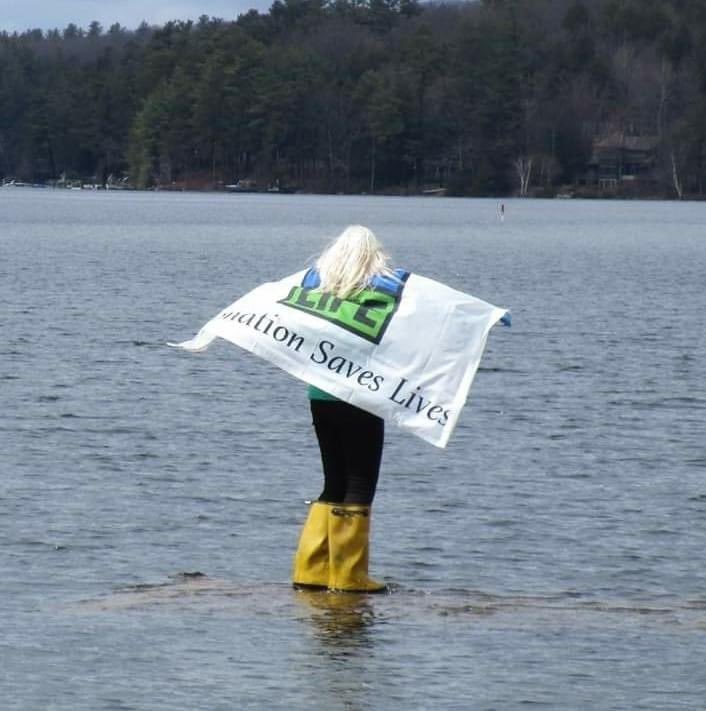 NEDonorServices's tweet photo. It’s no surprise to us that our volunteers walk on water, but how cool are these photos? 🙂💙💚 The water was quite high on May 1 when our volunteer, PJ, lowered the Donate Life flag in Newbury Harbor. #DonateLife #Volunteer #RegisterMe https://t.co/gVGiAdD6Ne