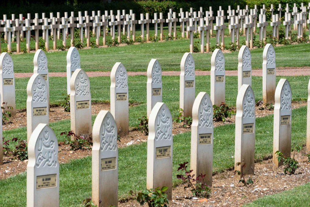 Muslim soldiers went into the trenches with imams who’s job was to recite the call to prayer into the ears of the dying.The evidence of their sacrifice is on display in a corner of Notre Dame de Lorette.Muslim headstones have Islamic inscriptions & tilt eastwards towards Mecca.