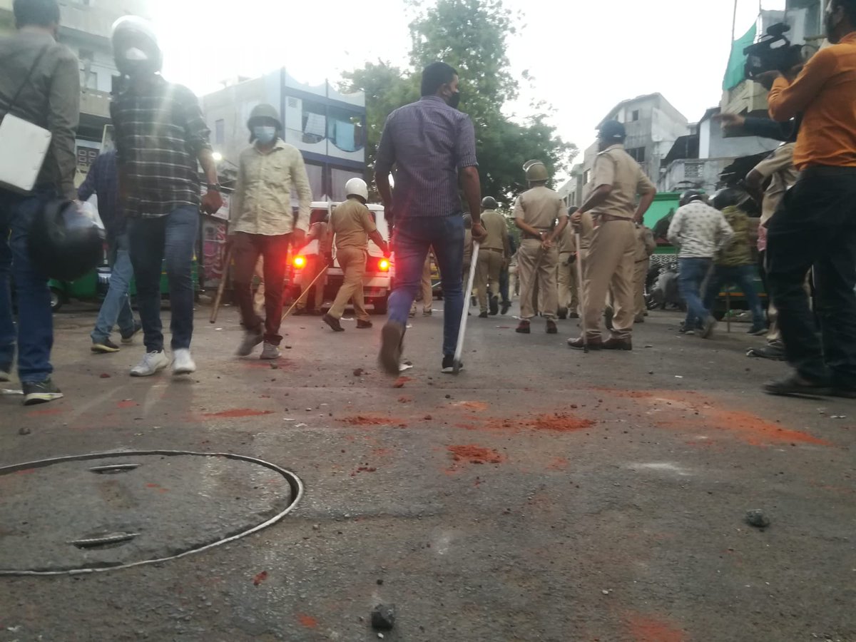 Police on lockdown duty lob tear gas shells to control stone pelting mob in Shahpur area of wall city Ahmedabad