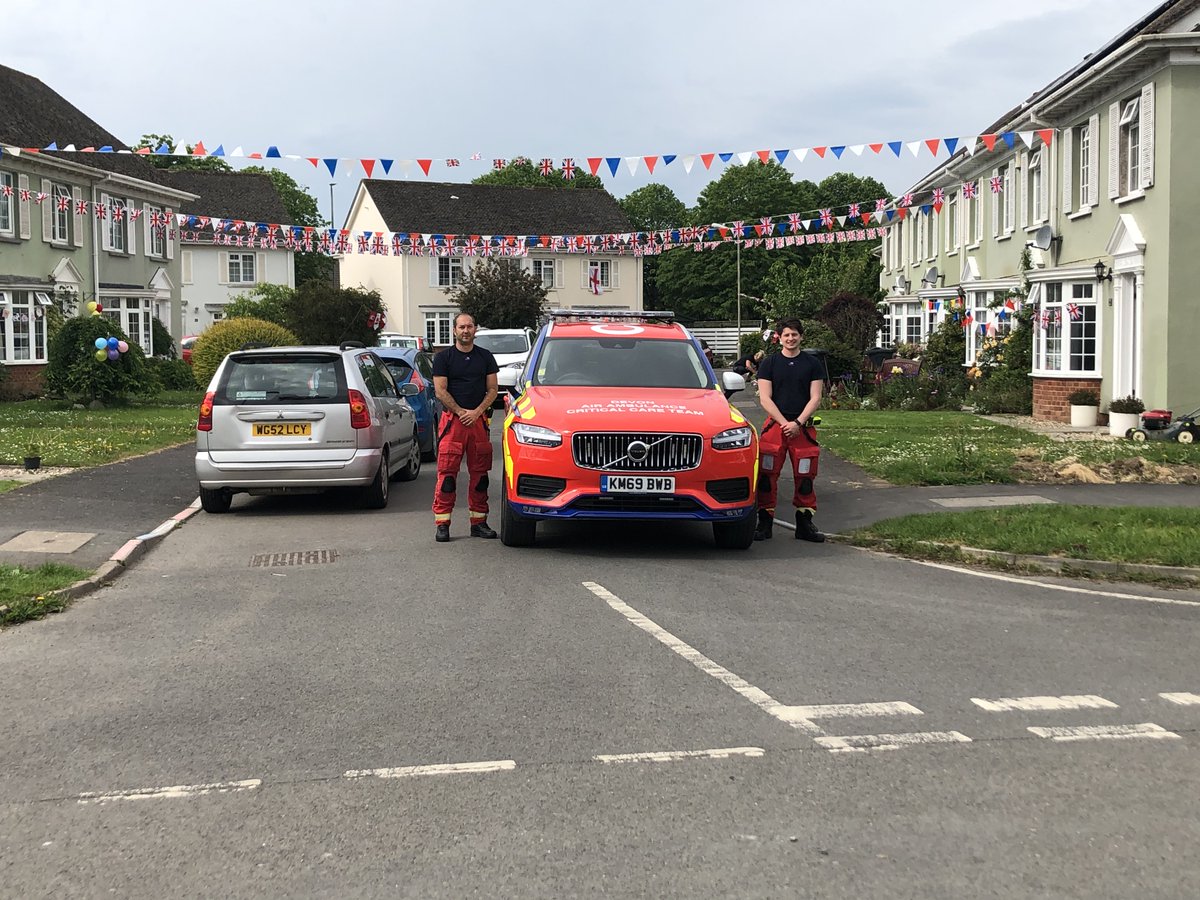 Our critical care car crew Josh and Darren were able to stop and spend their two minutes silence in #Braunton today at the end of this fantastically decorated street #VEDay75 #reflection #InItTogether