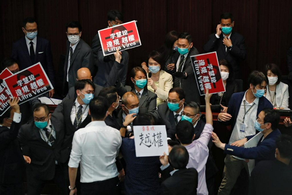 Reuters's tweet photo. Pro-China and democratic lawmakers scuffle in Hong Kong legislature https://t.co/LTaaFOualF https://t.co/kxL8FqAc8v