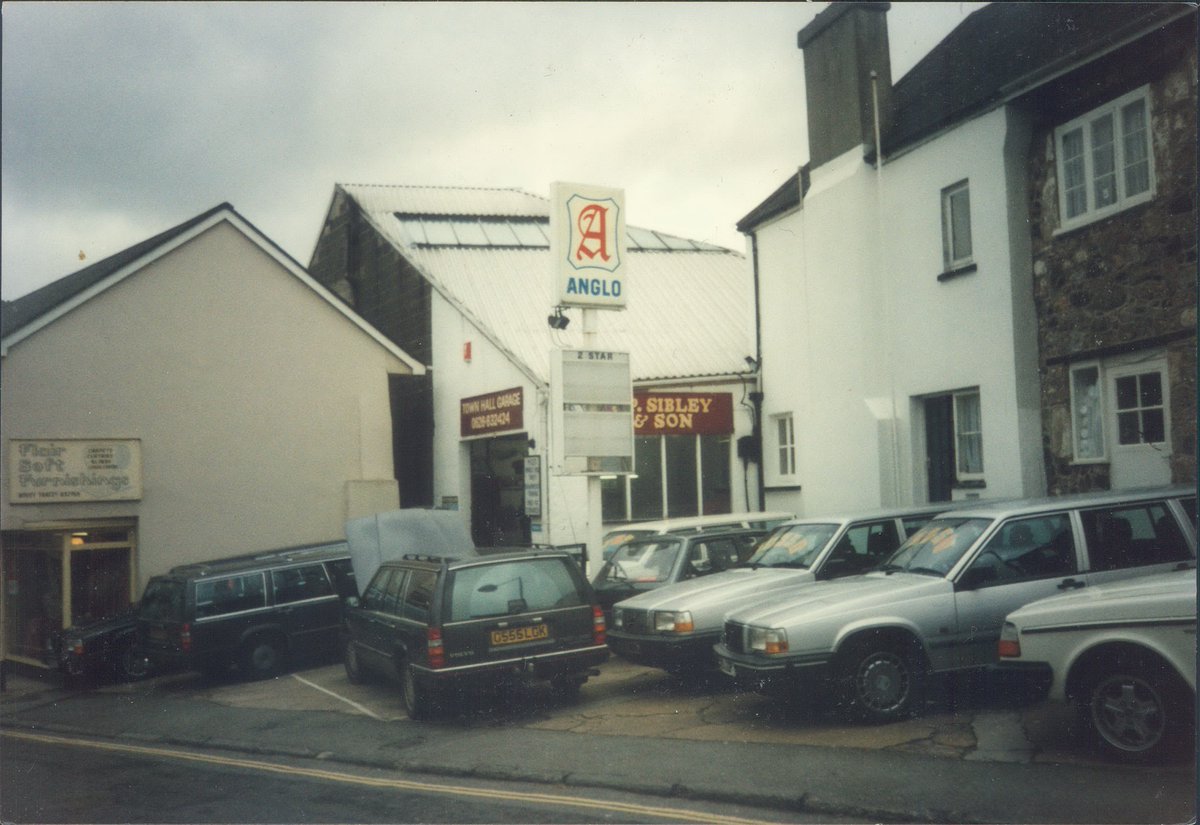 Day 138 of  #petrolstationsAnglo, J.P. Sibley & Son, Town Hall Garage, Bovey Tracey, Devon, 1995  https://www.flickr.com/photos/danlockton/16370220242/An impressive selection of big Volvos here! This used to be the A382 through Bovey Tracey, one of the main routes across Dartmoor.