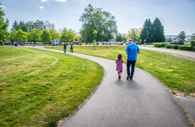 Executive Constantine walks on a quiet trail with his daughter.
