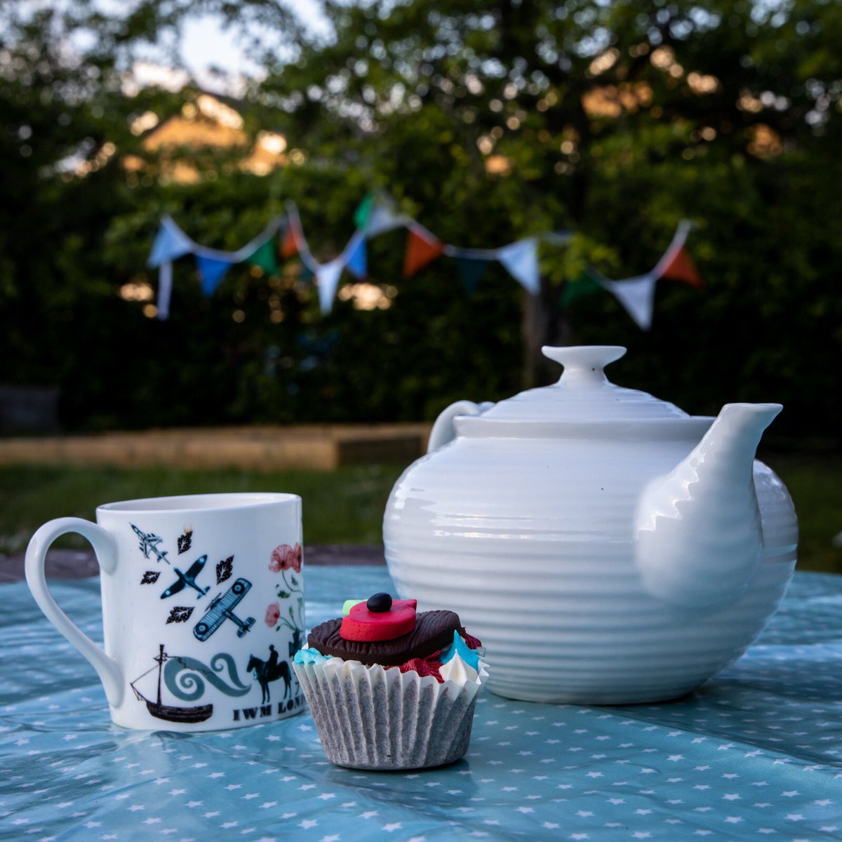 YorkScrubs's tweet photo. ‘At the going down of the sun and in the morning. We will remember them.’

The bunting was made from offcuts of scrubs - lots of the seamstresses involved in York Scrubs were present at the original VE Day celebrations. #VEDay75 #bbccake #VEDayAtHome  @ellyfyork https://t.co/Nt9yL6DPYq
