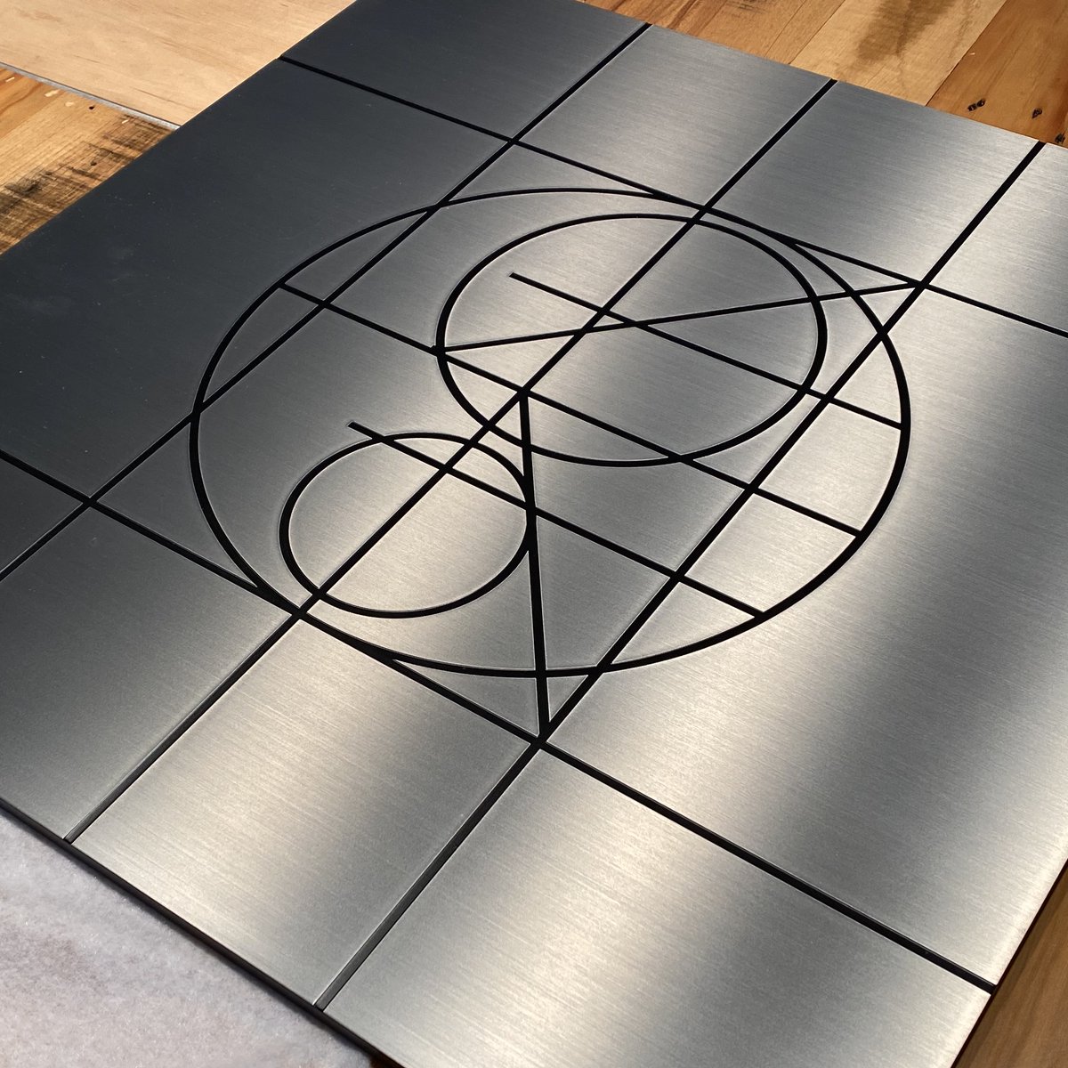 pointconcepts's tweet photo. Signs in production. Almost looks like crop circles. #wilsonart #stainlesssteel #shopbot #Routed #Signagedesign #cropcircles https://t.co/lHlRgl5Btq