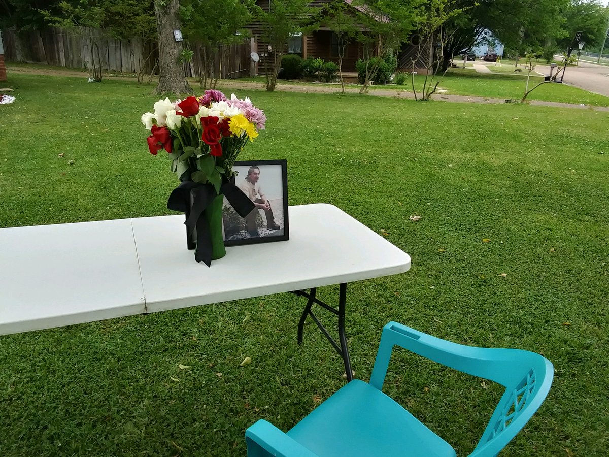 Because of the pandemic, Celso's family cannot commemorate his life as they would like. Instead, they've placed his framed photo and a vase of flowers on a table in their yard, inviting their community to stop by to pay their last respects in solitude.