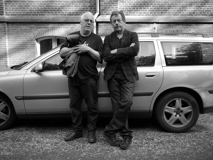 The man with me here is Paul Scully.
It is Holland in 2012.
I first met Paul in early June 1988.
It was in the lobby of a Japanese hotel in San Francisco.
I had flown from New York, to begin a LONG tour as opening act for The Pogues.
The first gig, and my first gig in San Fr…