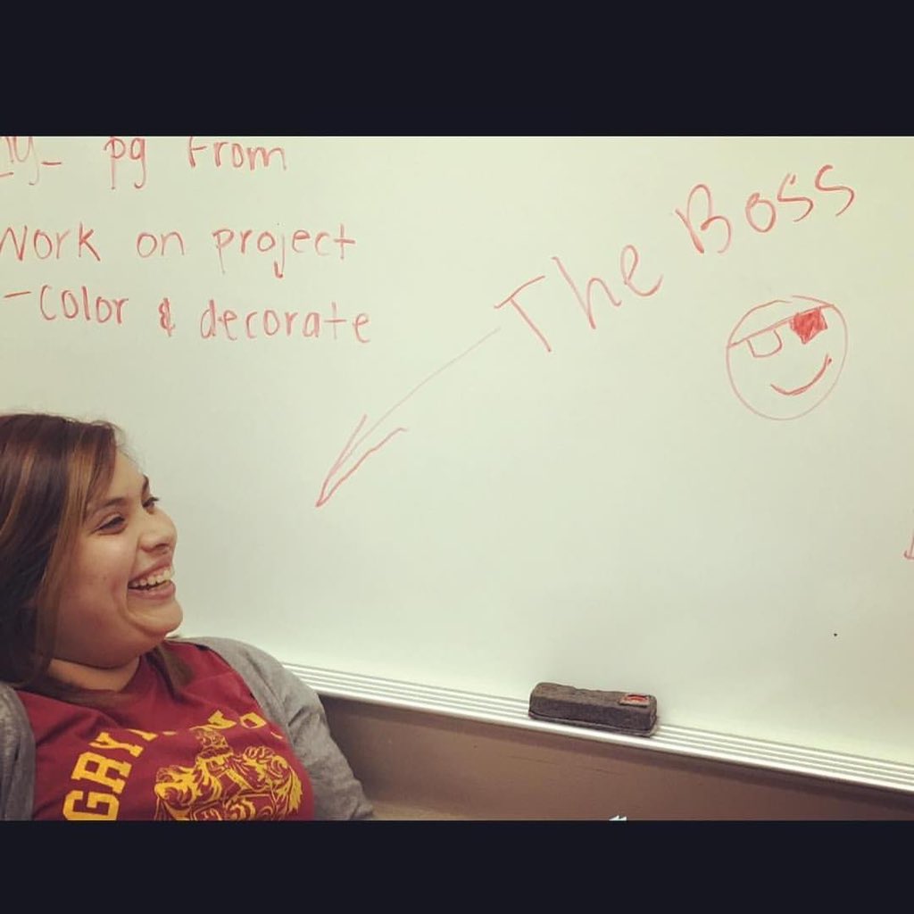 _MsParra's tweet photo. 5 years ago, I had asked one of my kiddos to take a picture of our whiteboard, and instead he took a picture of me and the sign they made me 😂. #firstyearofteaching https://t.co/BlMQPjDgNm