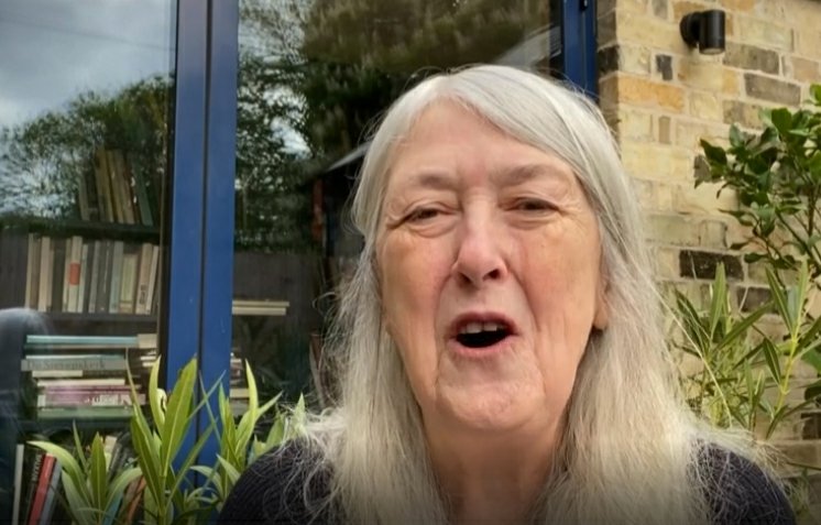 Mary Beard's credibility is so powerful that books drift towards her whenever they are in her orbit. Here she is in the garden and bookcases have begun to gather at the window. It is years since Mary was photographed without a bookcase behind her.