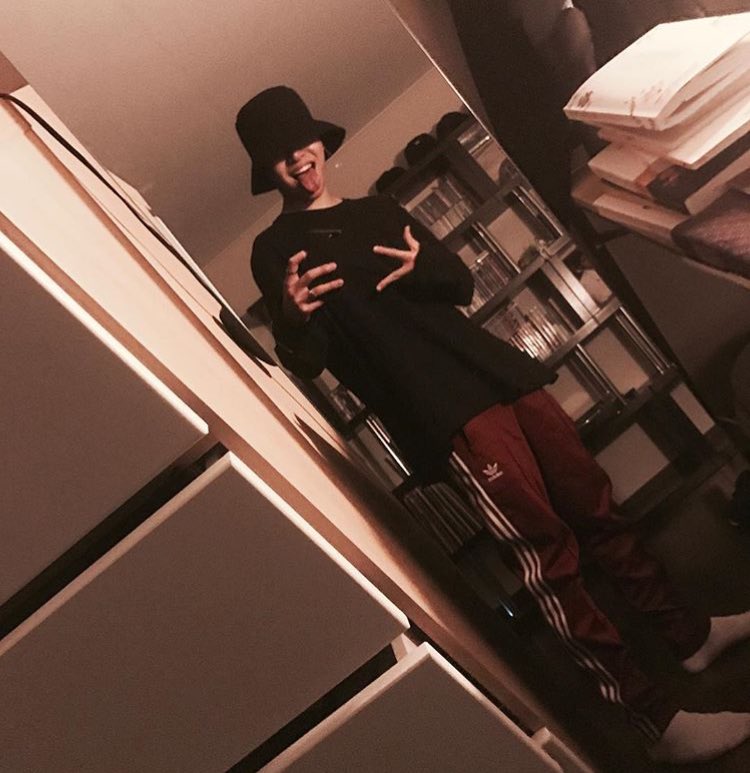 junhoe wearing bucket hat, a thread