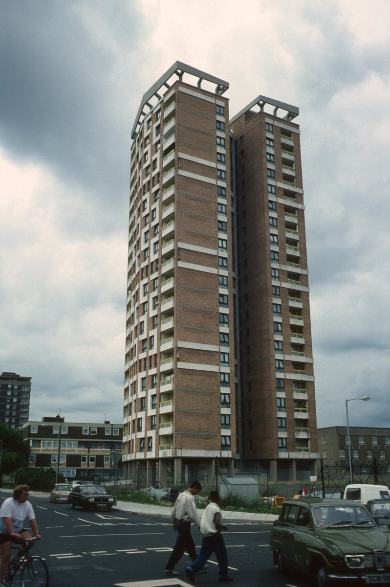 11/ The estate’s twenty-storey Sivill House, designed by Skinner, Bailey and Lubetkin, was completed in 1966. Here it is today, undergoing controversial renovation, last year and in 1988.