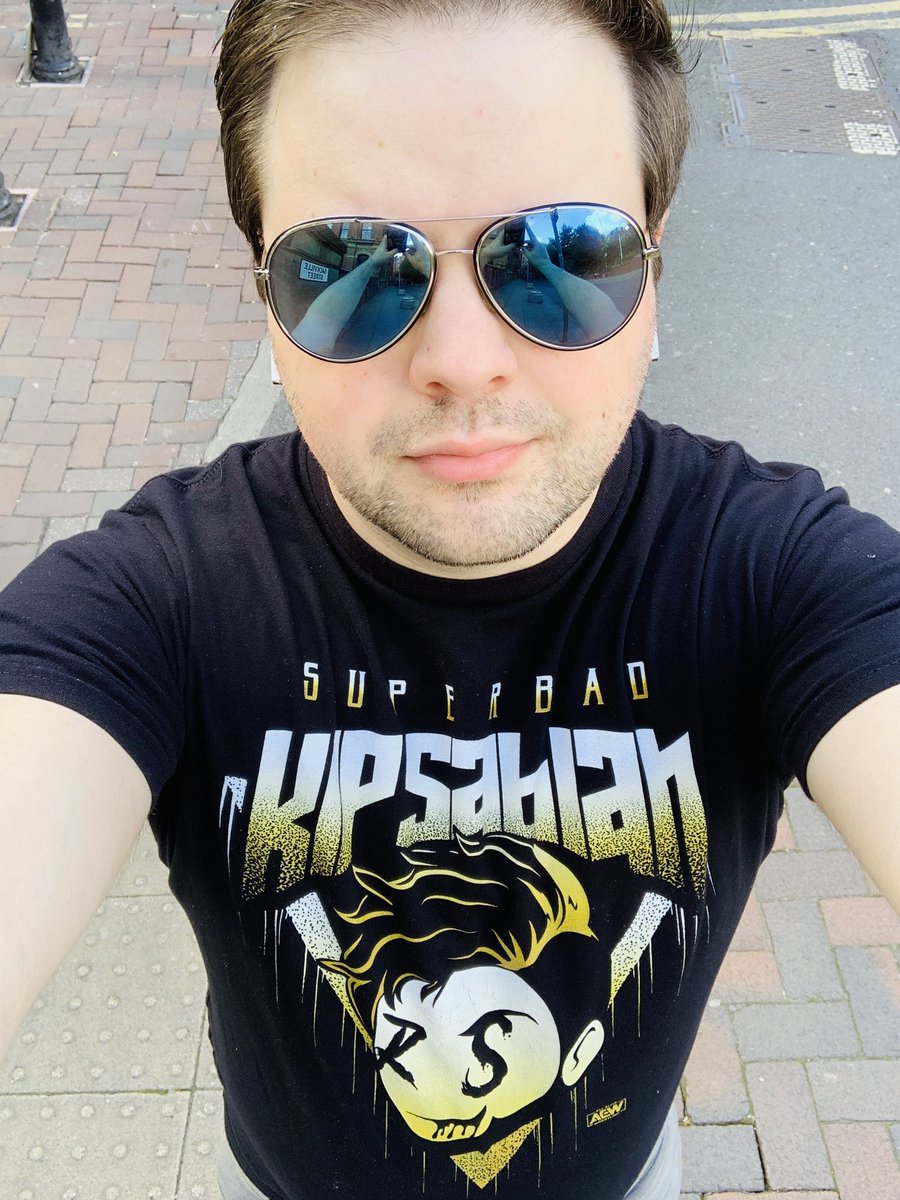 MARk_Prit's tweet photo. Geeking out in the Manchester sun wearing my @AEWrestling @TheKipSabian merch listening to the “Under the Black Hat” audiobook by @JRsBBQ on my daily exercise #teamsuperbad #slobberknocker https://t.co/bE1N07cwOX