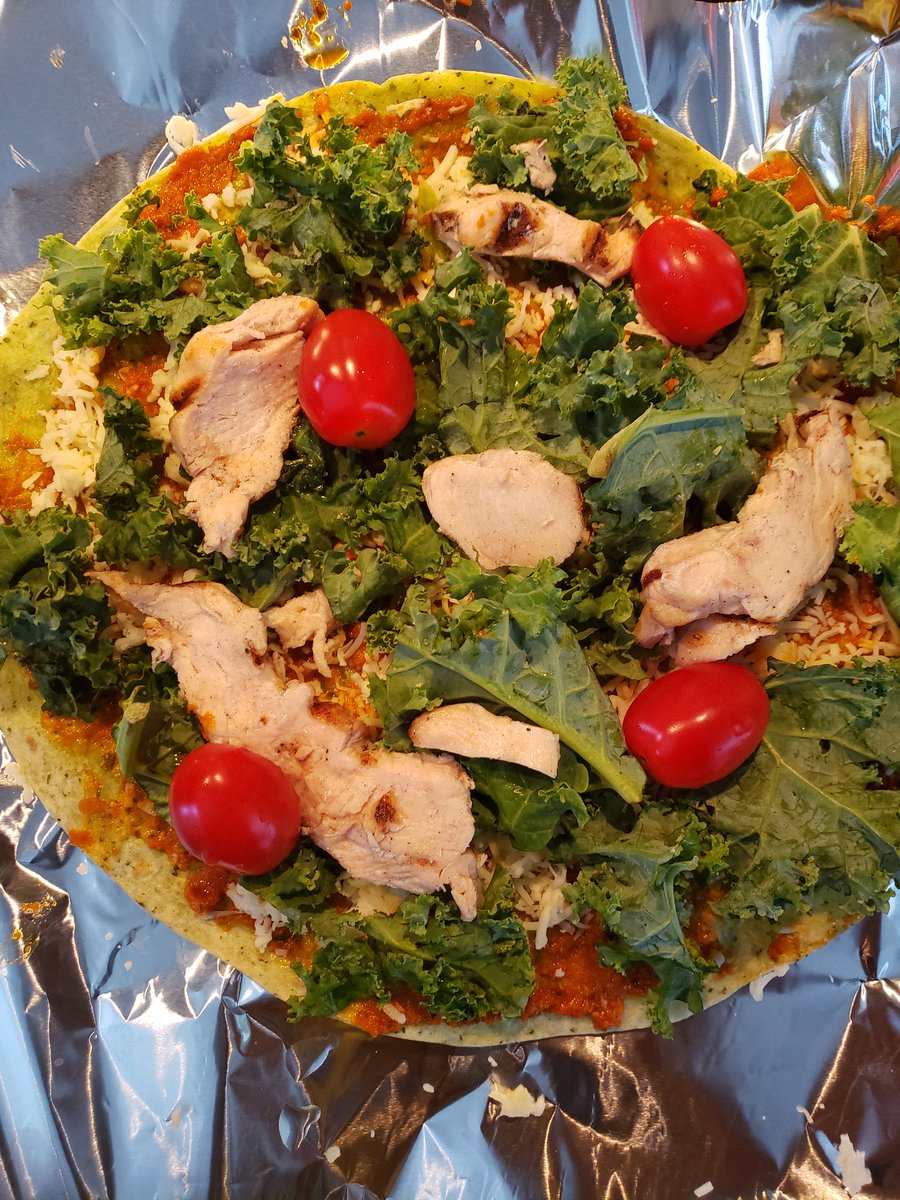 Trish_T's tweet photo. #BeforeAndAfter Simple #SpinachWrap #pizza Oven on broil for 7-10mins for crunchy edges! #TomatoPesto #Italianblend shredded cheese #kale #tomato The #chicken was dry though. 😑 #QuarentineLife #Foodie https://t.co/FjKDge7zEG