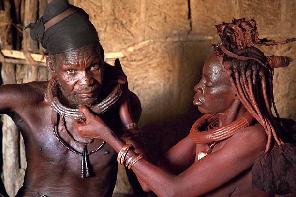 3. One of the elders of Wakanda wears the distinctive locks of ovaHimba women from Namibia. ovaHimba plait or twist their hair into thick locks, often leaving ends to puff. Film  Original 