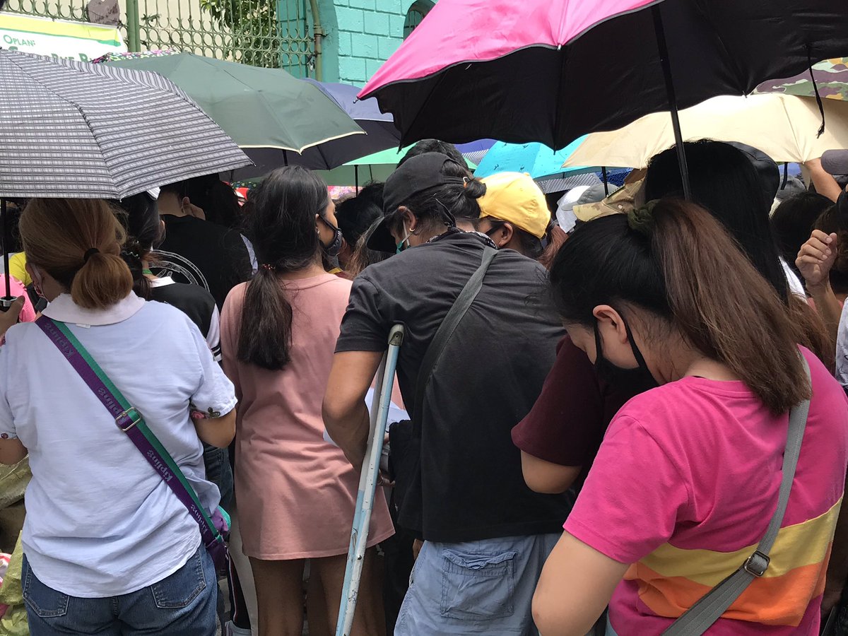 LOOK: People have been queuing up for the first tranche of the government’s cash aid program. Social distancing protocols have not been observed in the queue |  @cnnphilippines