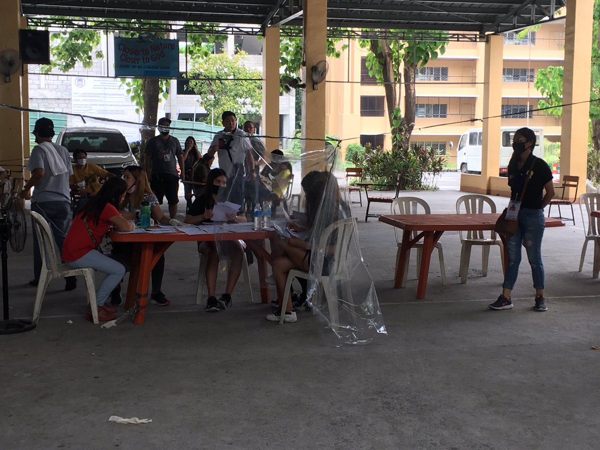 LOOK: Meanwhile, inside the school, social distancing protocols are observed Elderly, PWDs and pregnant women recipients are being prioritized for the cash distribution |  @cnnphilippines