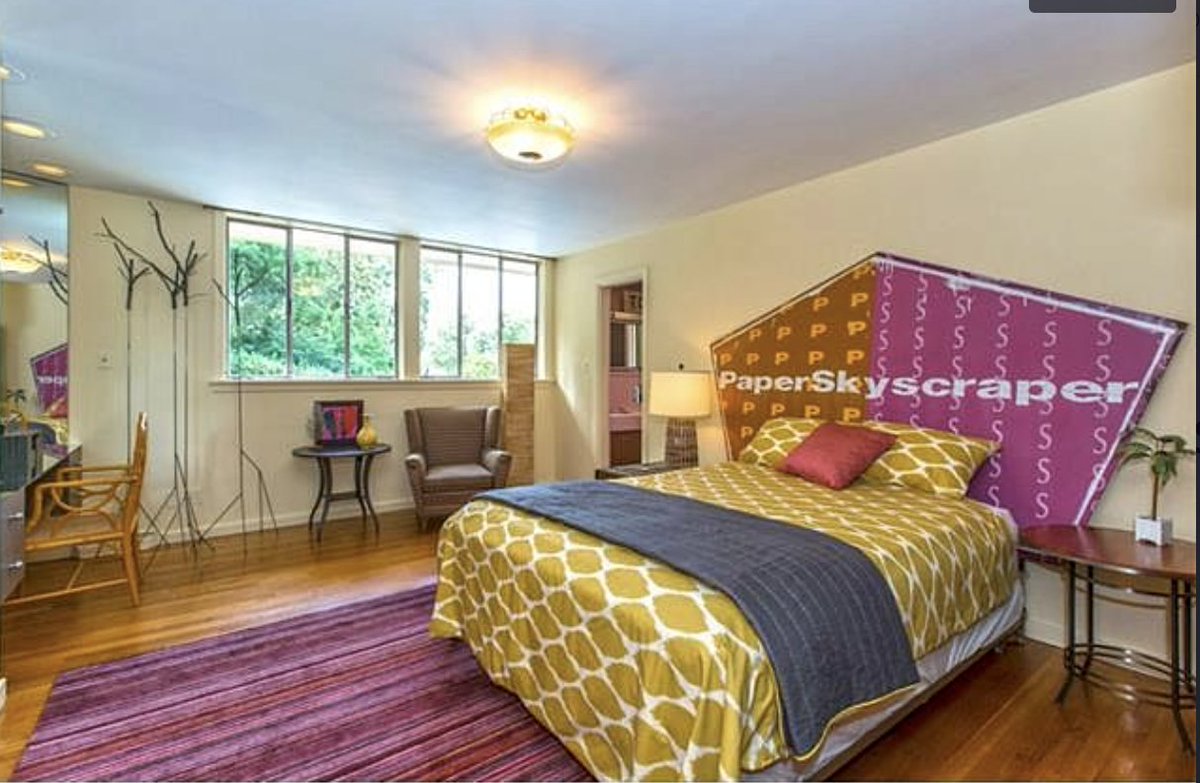 CLTdevelopment's tweet photo. Creepin houses on Zillow, because I'm looking for a Mid Century Modern, and I have to know why this house has a bed with a #paperskyscraper logo on the headboard. https://t.co/ElVi7lJBaC