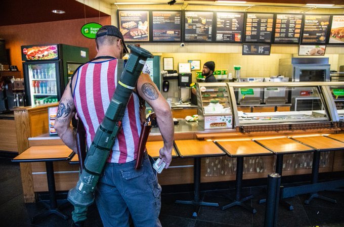 In case you were wondering, this is tough guy cosplay in the most ~literal~ sense of the word. He’s carrying a big prop weapon around because he’s an idiot poser trying to look intimidating to the guy who has to make his sandwich, I guess.