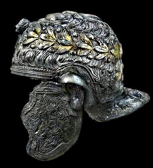 The beautiful 1stC AD Roman cavalry helmet discovered in Xanten, Germany. Part gilded with silver sheathing over an iron core, the helmet is decorated to represent short hair wearing a wreath and would've originally been highly polished, now in the Bonn museum, Germany.