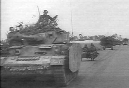 This is because this Pz IV was originally from Panzer Lehr, here’s a still from a well known clip of ‘sister’ tank, ‘333’, still in Lehr service, but was transferred to Pz Regt 22 of 21st Panzer in May, 44...